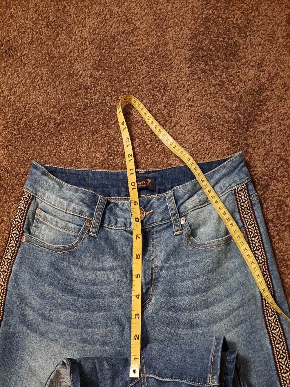 Seven7 Boho denim shorts featuring distinctive embroidered side detailing